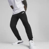 Wyprzedaż - Spodnie dresowe męskie Puma ESS LOGO PANTS TR dopasowany fason do codziennego użytku czarne (586716-01)