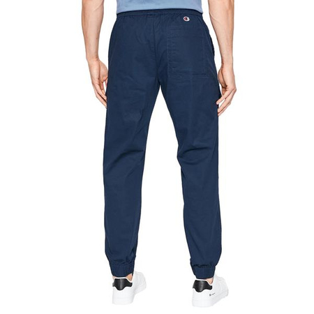 Spodnie dresowe męskie Champion Rochester Elastic Cuff Pants joggery granatowe (217179BS538)